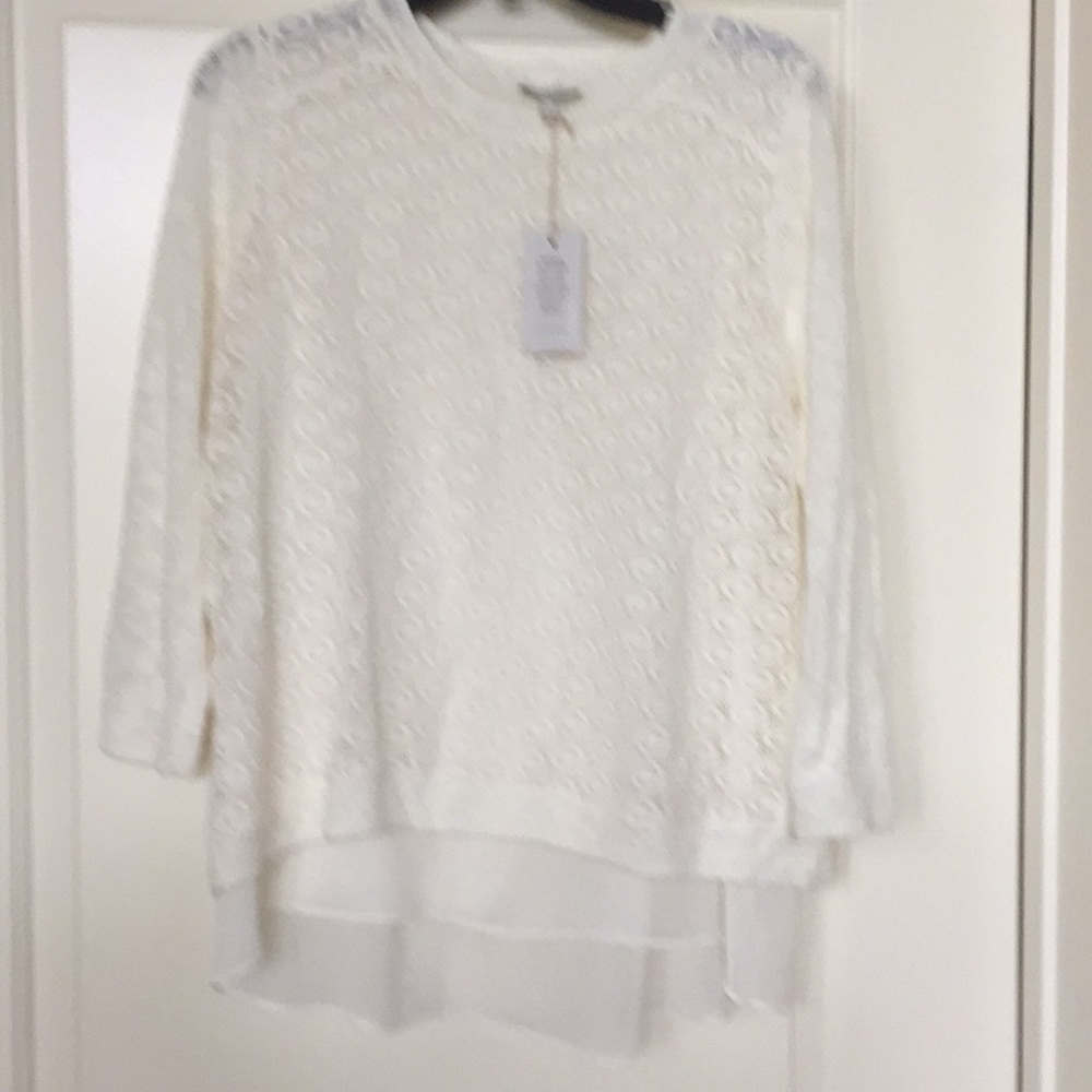 Cream colored 3/4 length sleeve top.